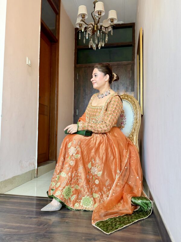 Rusty orange embroidered Anarkali dress with green detailing